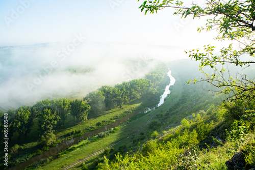 Beautiful landscape photo with mysterious dense fog. Morning with fog.