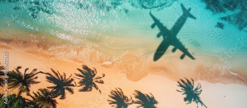 Fototapeta Naklejka Na Ścianę i Meble -  Travel concept with airplane shadow and tropical beach. Tropical paradise and beach holiday conceptual image. Copy space image. Place for adding text or design