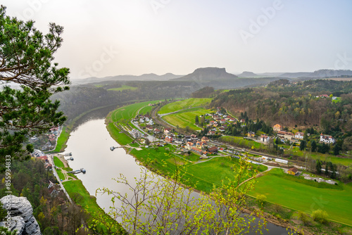 Overlooking the gentle curve of the Elbe River, surrounded by the lush greenery of Saxon Switzerland National Park. Germany © pyty