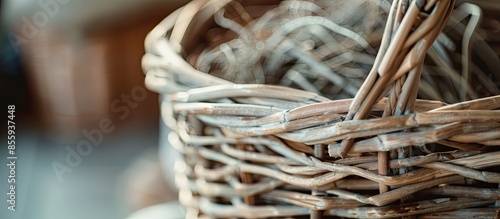 weaving wicker basket indoors, closeup view. materials needed for weaving baskets and other products from paper tubes. Hobbies and craft. Copy space image. Place for adding text or design photo