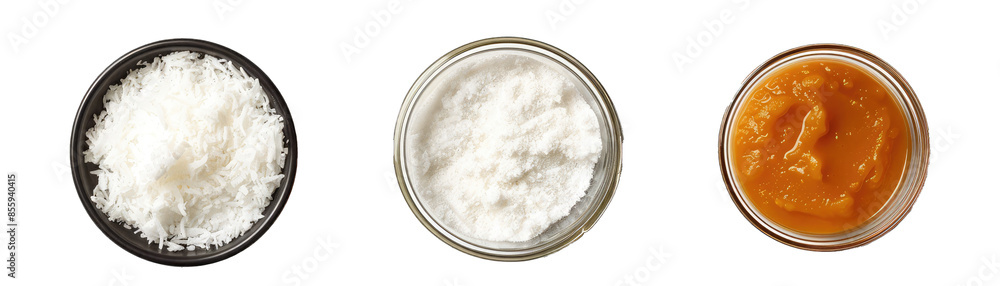 Flaked Coconut, a Can of Pumpkin Puree, and a Jar of Tahini. Isolated on a Transparent Background. Cutout PNG. Flaked Coconut, a Can of Pumpkin Puree, and a Jar of Tahini. Isolated on a Transparent Background. Cutout PNG.