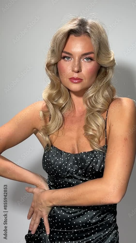 Woman in polka dot dress with beautiful make-up and hairstyle Woman in polka dot dress with beautiful make-up and hairstyle