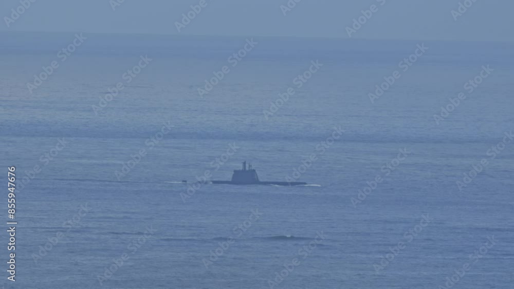 A submarine is floating in the ocean