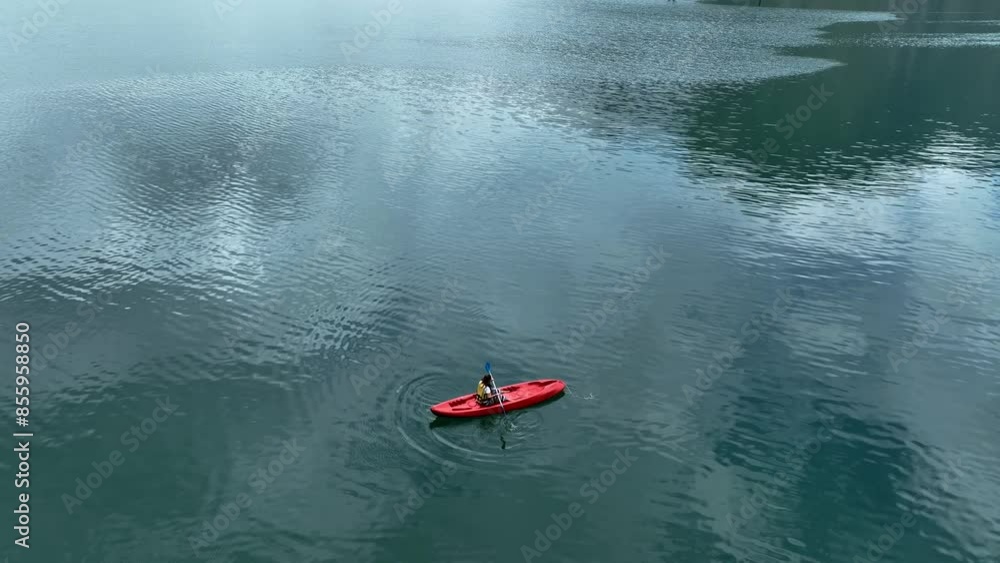 Aerial view of woman traveller exploring calm tropical bay ,Travel and Active Lifestyle concept Aerial view of woman traveller exploring calm tropical bay ,Travel and Active Lifestyle concept