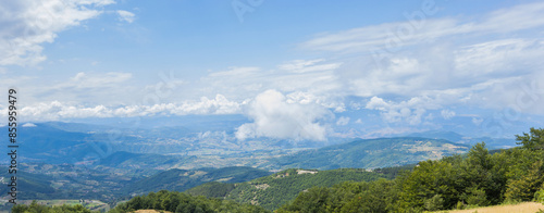 Panoramic View Of Kopaonik Mountains, Serbia,  Lush Greenery Hills And A Vibrant Blue Sky WIth Clouds, Showcasing Natural Beauty On Summer Day © mitarart