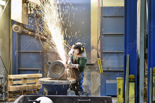 workers in an industrial plant - workplace foundry - production of steel castings