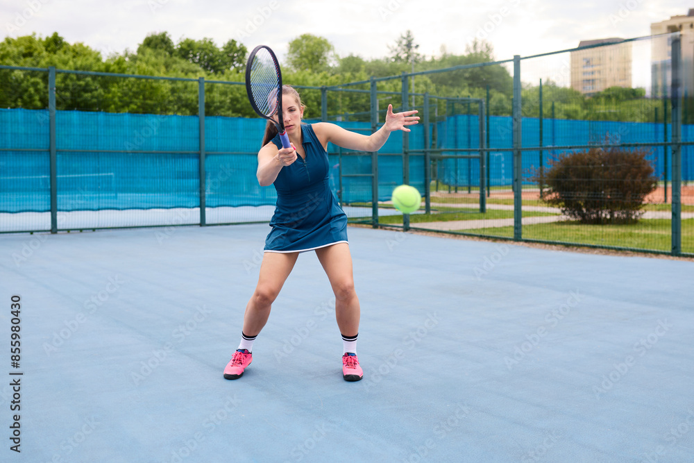 Young athlete woman practicing tennis on the court Young athlete woman practicing tennis on the court
