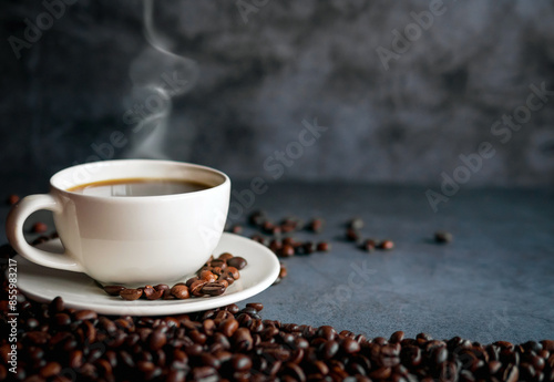 Coffee cup and coffee beans on  gray background, Black coffee cup aromatic
