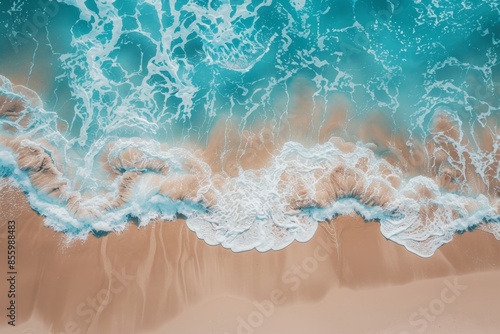 Summer concept with a soft blue ocean wave or clear sea on a clean sandy beach