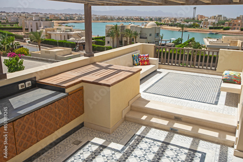 Terrace balcony with sofa in tropical luxury apartment resort