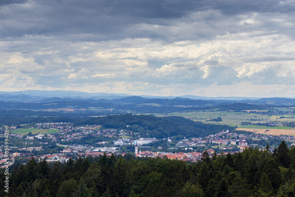 Aerial view to city Pisek from lookout with overcast sky. History Czech town, tourism background Aerial view to city Pisek from lookout with overcast sky. History Czech town, tourism background