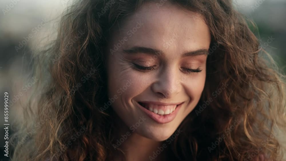 Woman with curly hair in various poses, outdoors, natural lighting, smiling and serene expressions Woman with curly hair in various poses, outdoors, natural lighting, smiling and serene expressions
