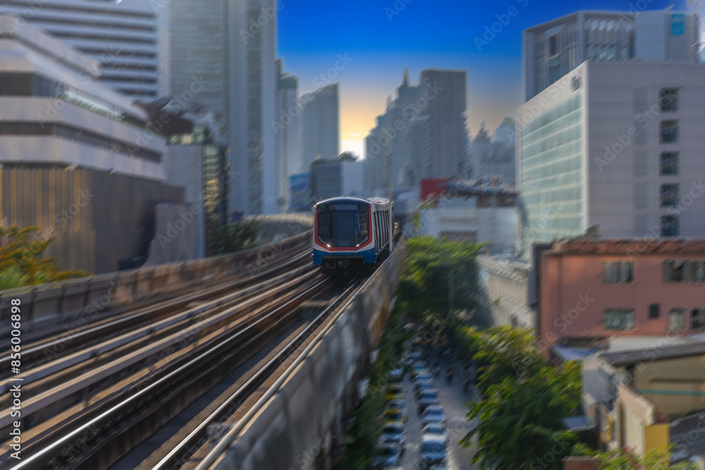 Naklejka premium BKK BTS Bangkok Mass Transit System Sky train which is an elevated tram over the busy streets oh BKK Thailand 