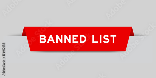Red color inserted label with word banned list on gray background