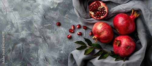 gray textile with pomegrana...