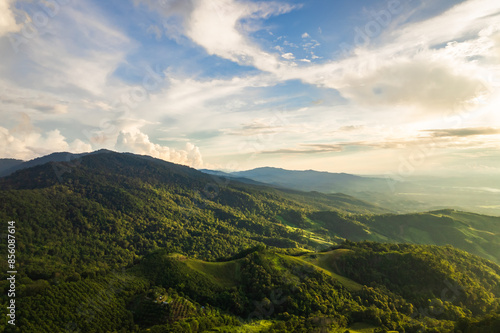 Beautiful sunlight and blue sky with cloud over the mountain of Thailand.