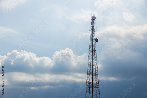5G Telecom signal tower. Telecommunication Tower on blue cloudy storm sky for background, Technology Mobile Network Concept.