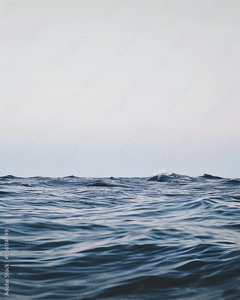 Fototapeta premium This close-up shot of the water captures the subtle movement and texture of small waves, highlighting the beauty of simplicity