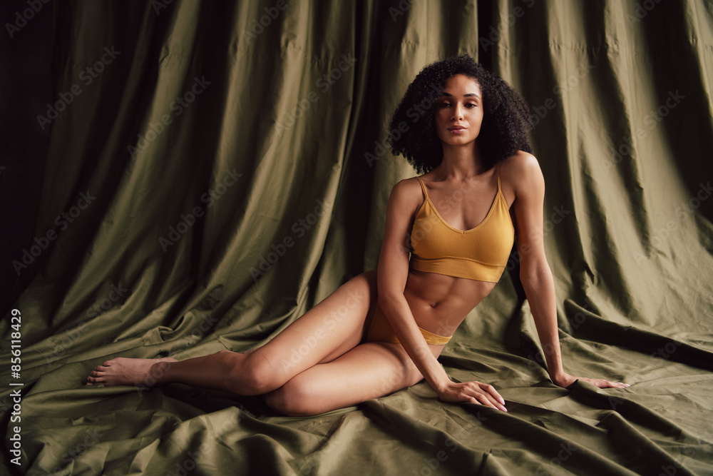 No retouch photo of gorgeous stunning girl sitting comfort trendy underwear isolated on fabric khaki color background