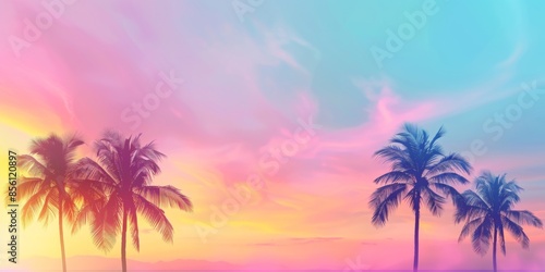 A scenic view of three palm trees silhouetted against a vibrant sunset sky  displaying shades of pink  orange  and blue.