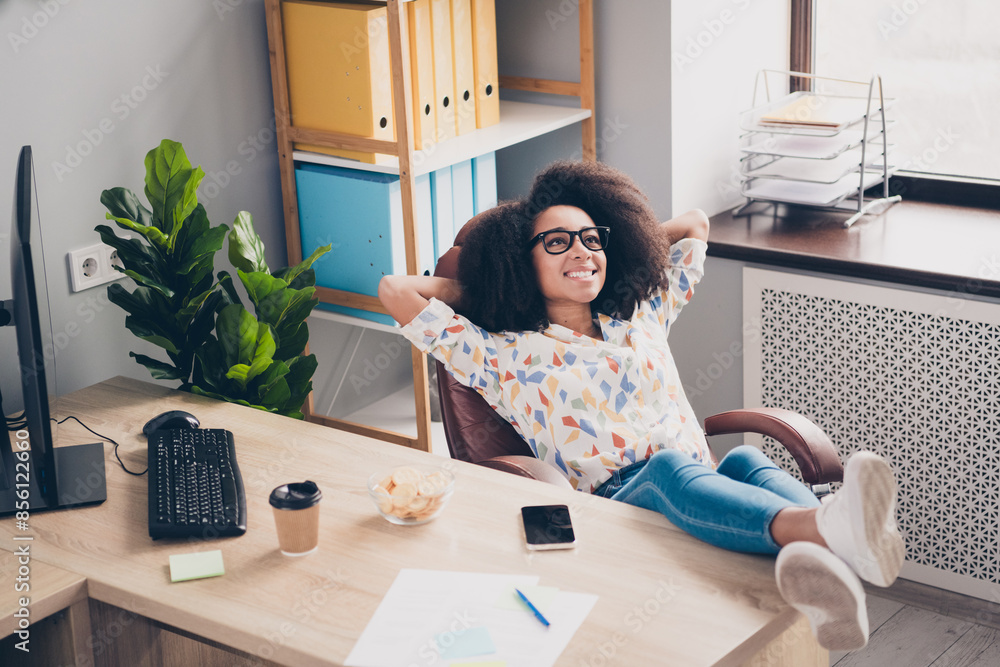 Photo of charming adorable woman sitting chair holding arms behind head relax rest indoors workspace Photo of charming adorable woman sitting chair holding arms behind head relax rest indoors workspace