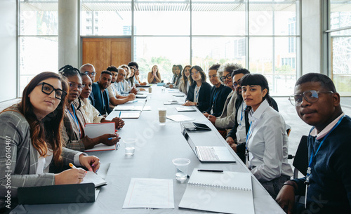 Canvastavla First person view of a big team staff meeting in a modern conference room