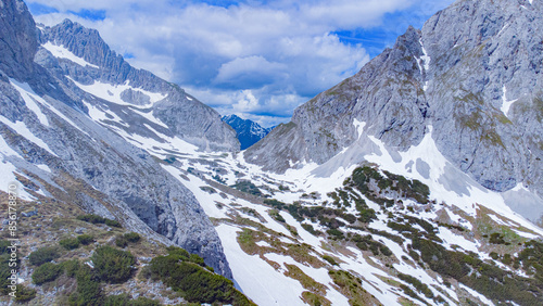 Wallpaper Mural Top view of Alpine mountains covered in snow in a spring day at Sonnenspitze, near Ehrwald, Austria Torontodigital.ca