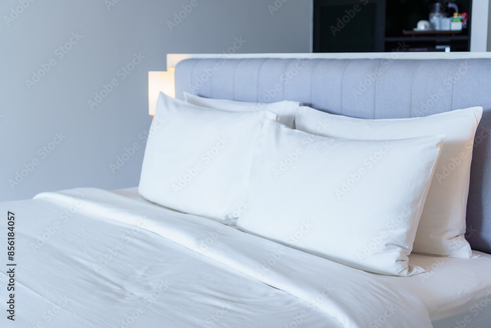 Closeup of new bed comforter with white pillows, headboard in bedroom of hotel. Closeup of new bed comforter with white pillows, headboard in bedroom of hotel.