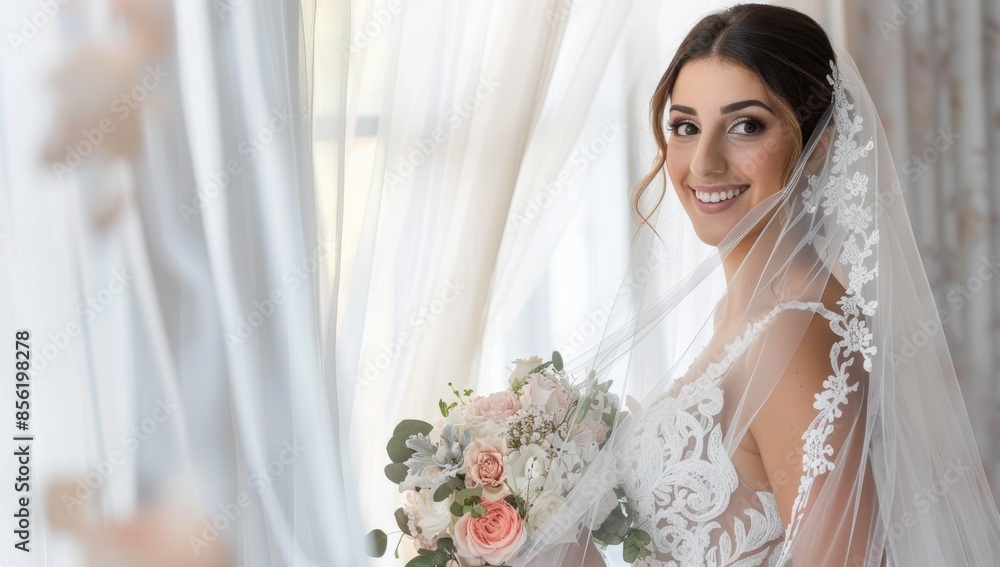 Naklejka premium A beautiful bride in her wedding dress, holding flowers and smiling at the camera