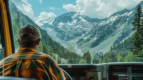 A truck driver looking out at the scenic view as he drives through a mountain pass. photorealism, copy space, minimalism