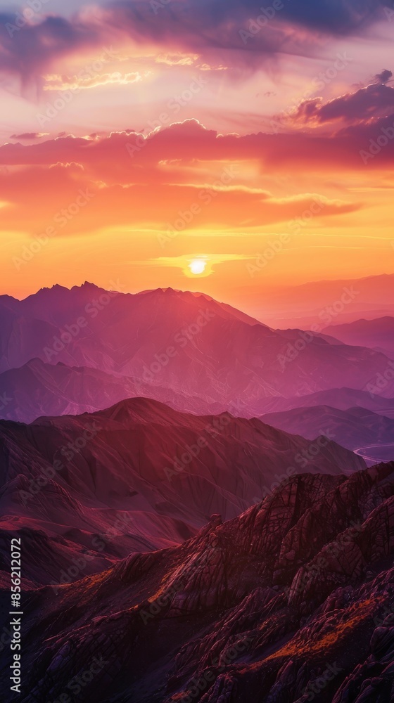 Obraz premium Mountain range during sunset with vibrant colors, panoramic view. Nature and tranquility concept