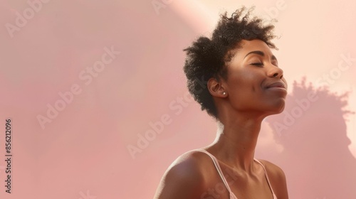 A woman with closed eyes enjoying a moment of relaxation or meditation set against a warm pinkish-orange backdrop.