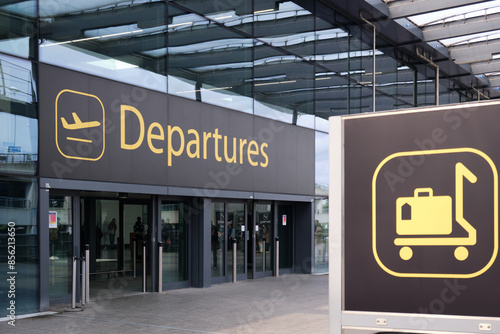 Gatwick Airport, London, United Kingdom:  April 22 2024. Entrance to departures. Signage in foreground. photo