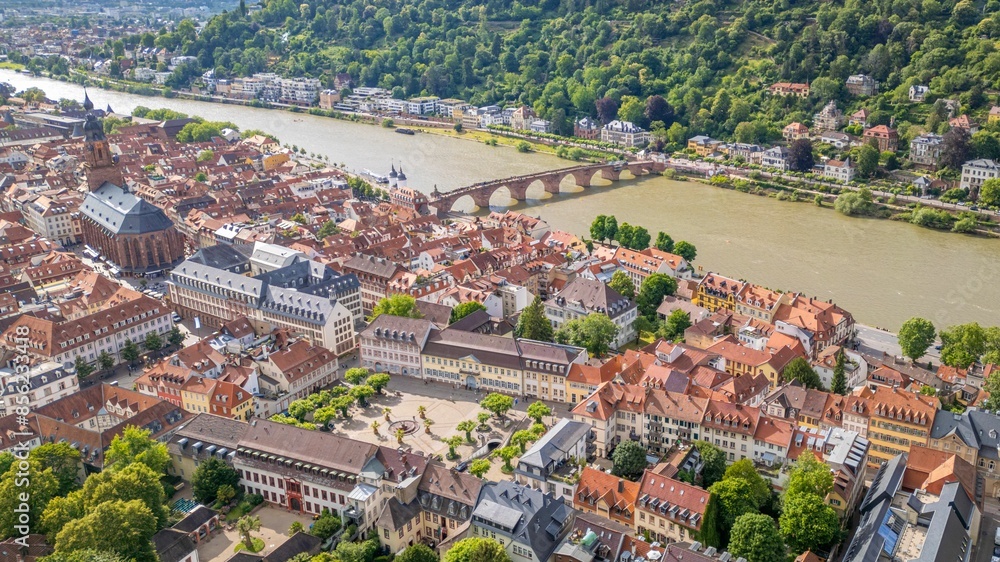 Fototapeta premium Aerial view of Heidelberg's old town with the Church of the Holy Spirit and the Old Bridge