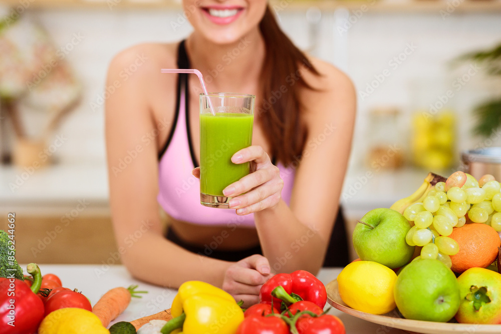 Happy Woman Drinking Fresh Green Detox Vegetable Juice, Showing Glass To Camera Happy Woman Drinking Fresh Green Detox Vegetable Juice, Showing Glass To Camera
