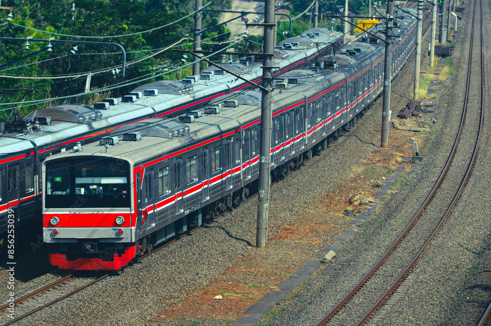 Fototapeta premium View of a passenger train moving in a rural or hilly area