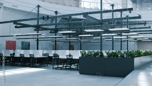 Contemporary working area. Interior of modern workplace with conference zone and covered computers photo