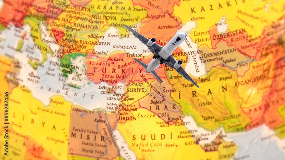Naklejka premium Passenger plane taking off against the background of part of the world map.