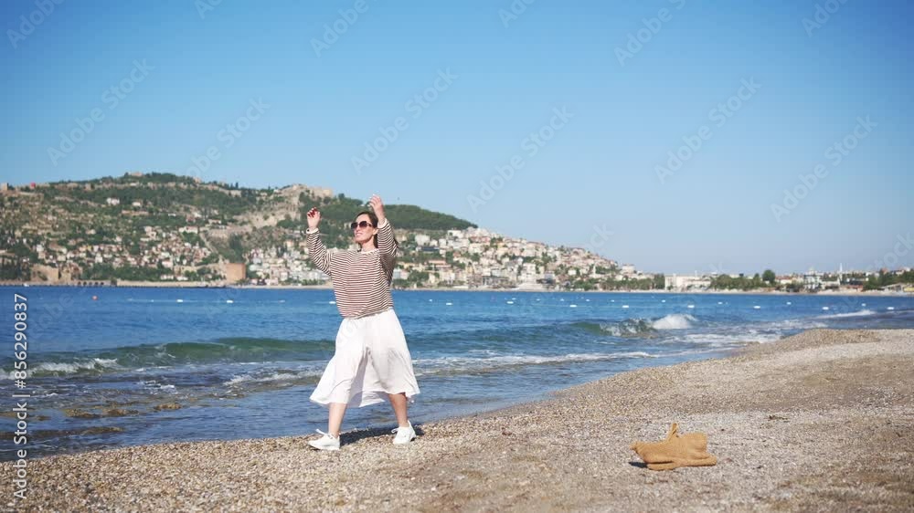 Happy traveller woman walking and enjoying Mediterranean Sea beach vacation. Happy traveller woman walking and enjoying Mediterranean Sea beach vacation.