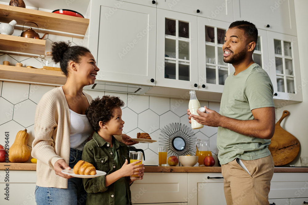 custom made wallpaper toronto digitalAn African American man and woman stand in a kitchen with a young boy.