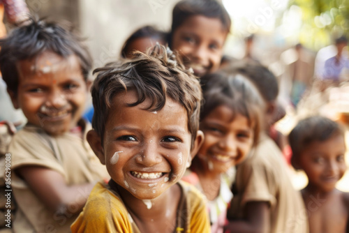 Group of diverse, cheerful multi-ethnic children from India smiling and looking at the camera outdoors