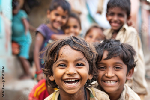 Group of diverse, cheerful multi-ethnic children from India smiling and looking at the camera outdoors