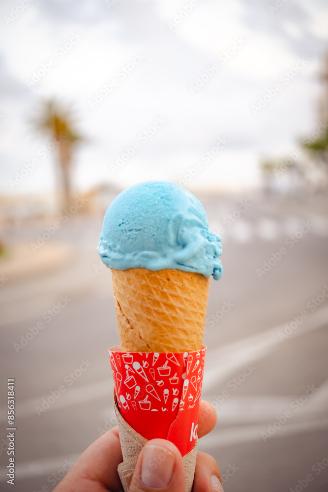 blue ice cream cone with blurred background blue ice cream cone with blurred background