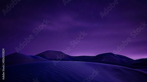 A purple sky with stars over a desert.