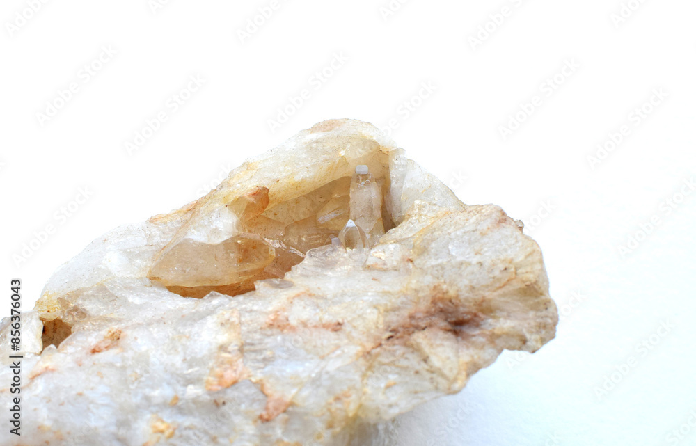 Cluster of natural quartz crystals on a white background. Cluster of natural quartz crystals on a white background.