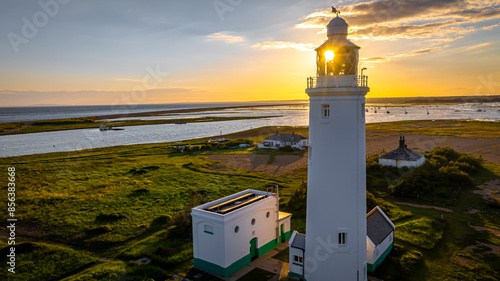 Sunset view of Hurst Point Lighthouse is located at Hurst Point in the English county of Hampshire photo