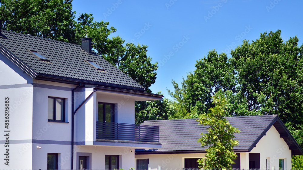 New single family house in a new development area. Residential home with modern facade. New single family house in a new development area. Residential home with modern facade.