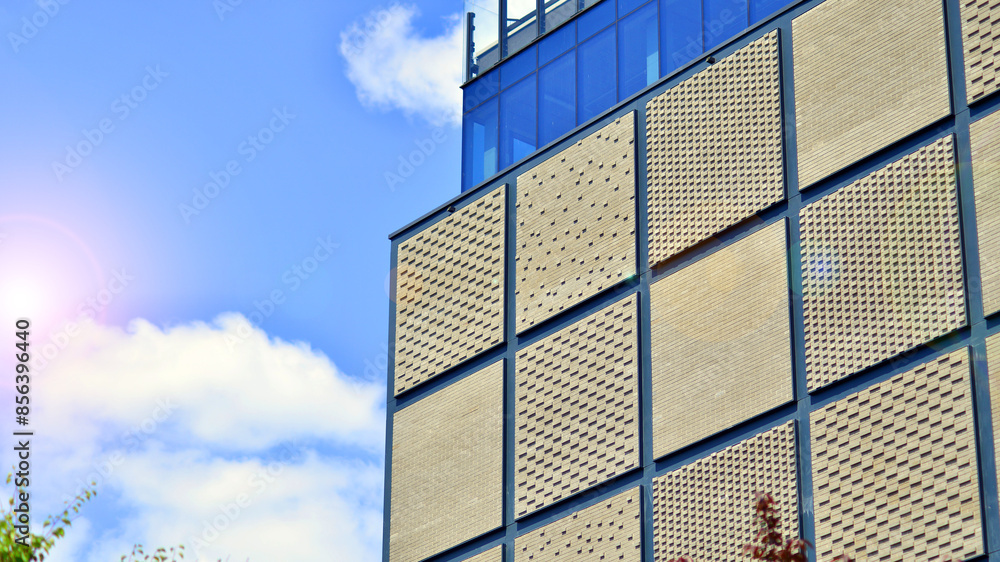 Obraz premium Facade of building with modern elements. Exterior of a modern industrial building. 