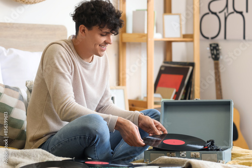Young man with vinyl disks ...