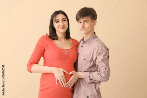 Happy expectant couple form...